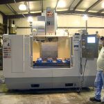 Employee Max Rasbury with the Haas VF-4